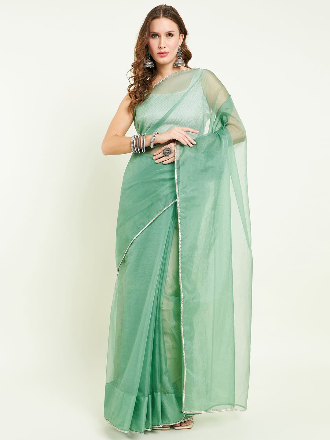 Organza saree with gota lace comes with matching gota patti blouse.