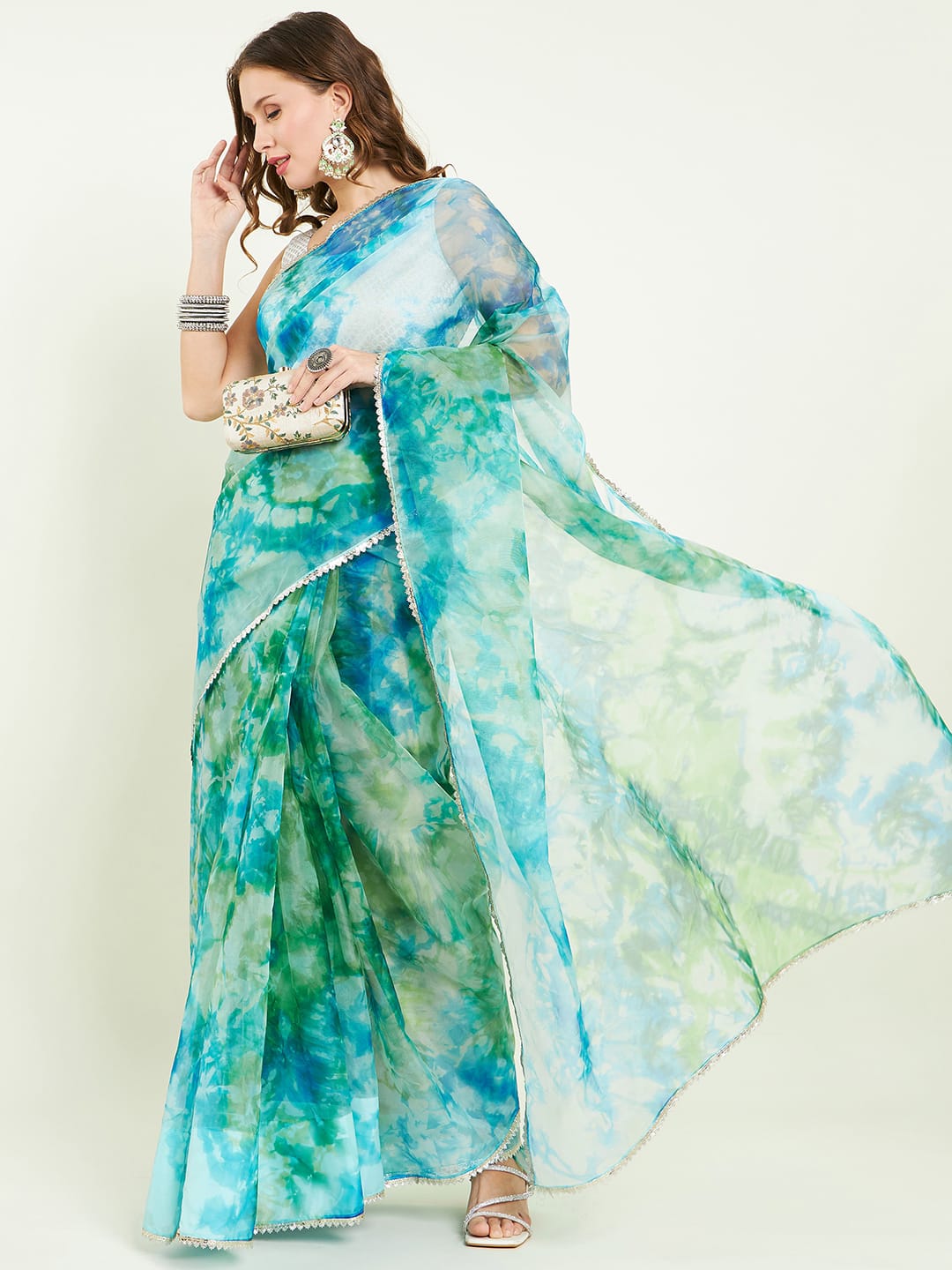 Organza Tie&dye saree with lace detailing comes with matching blouse.