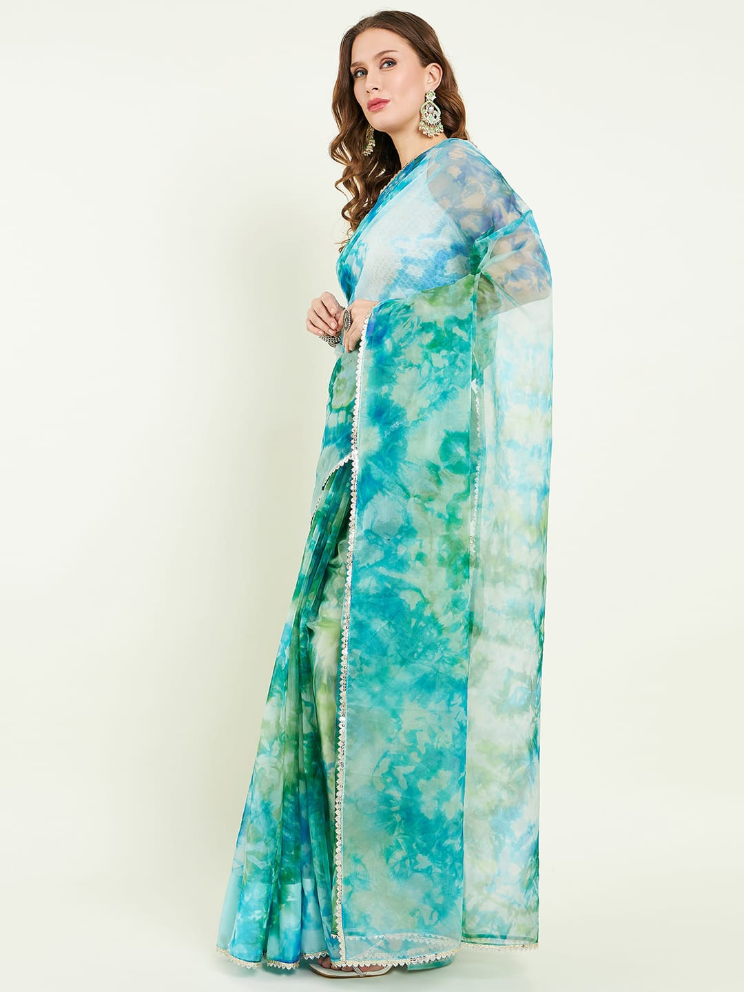 Organza Tie&dye saree with lace detailing comes with matching blouse.