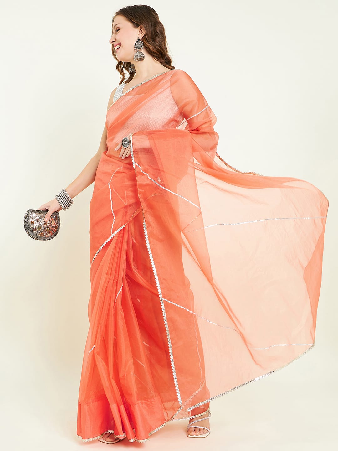 Organza saree with gota lace detailing on saree comes with gota embellished blouse.