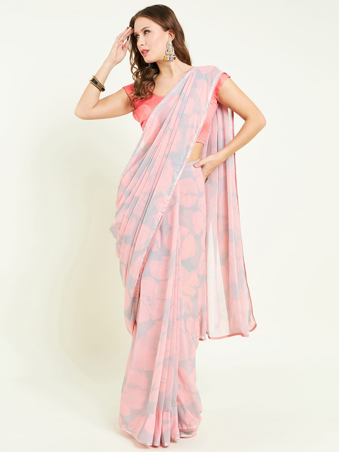 Digital printed floral saree embellished with lace detail.