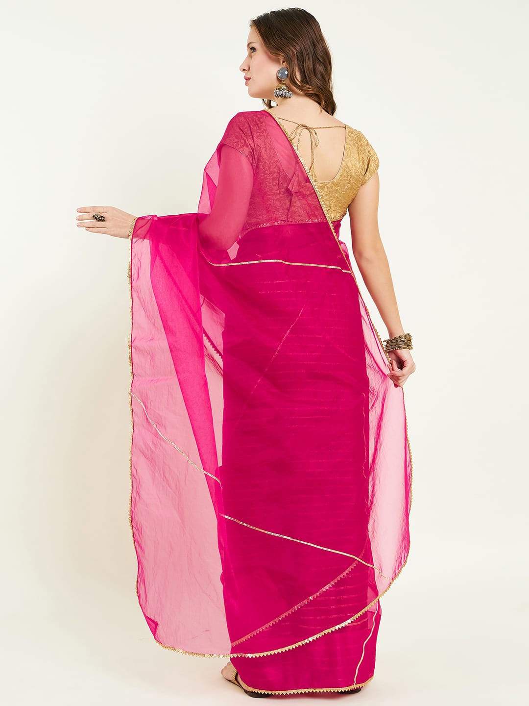 Organza saree with gota lace detailing on saree comes with heavy gota blouse.