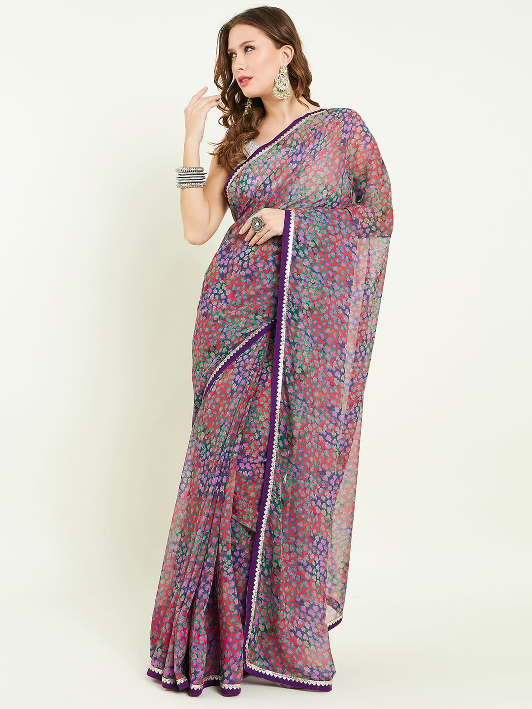 Digital printed floral saree embellished with lace detail comes with solid blouse.