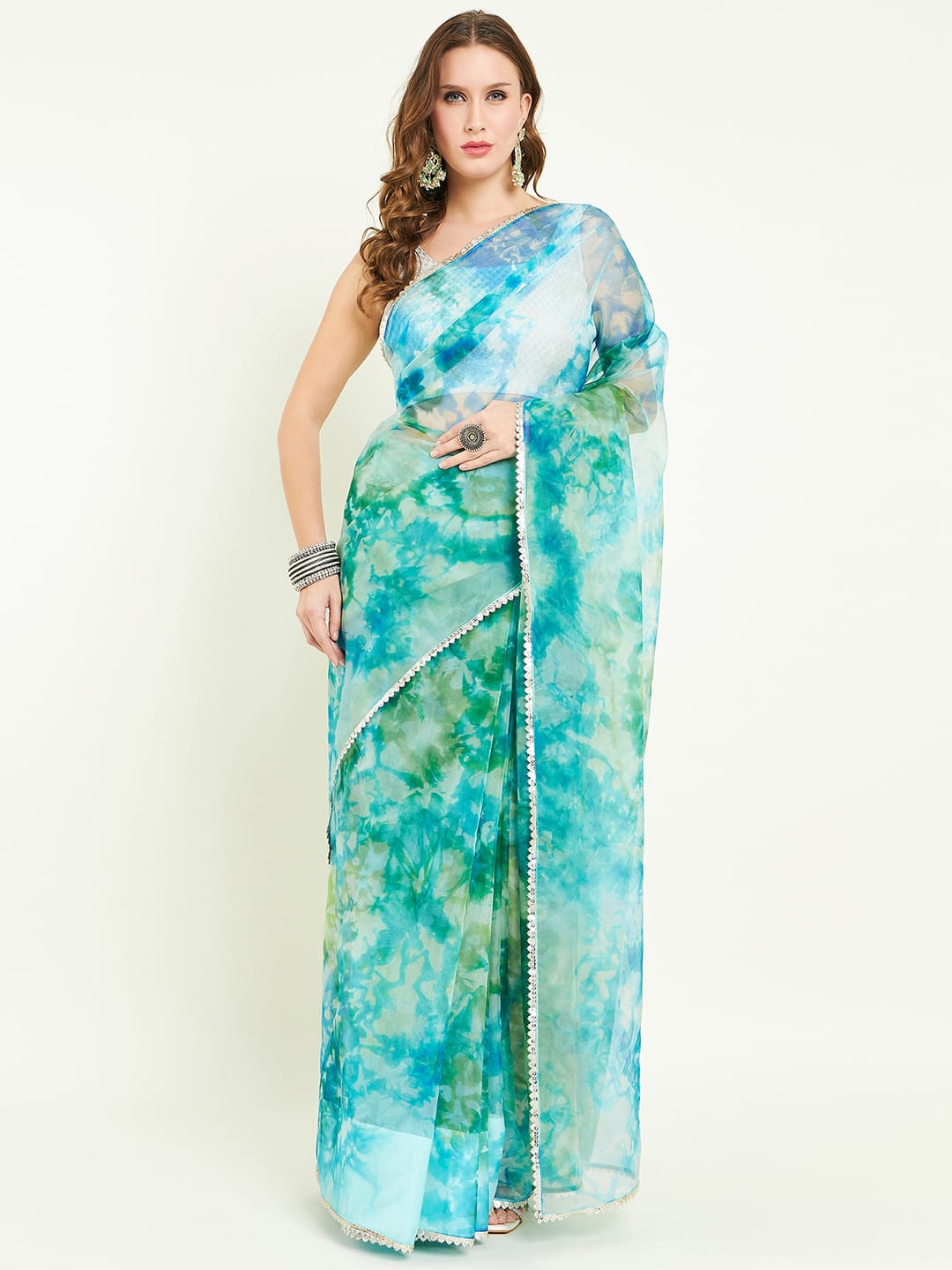 Organza Tie&dye saree with lace detailing comes with matching blouse.