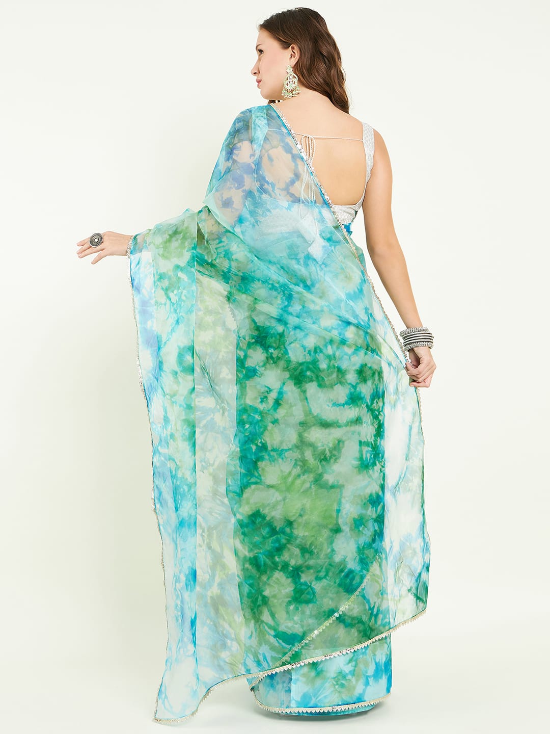 Organza Tie&dye saree with lace detailing comes with matching blouse.