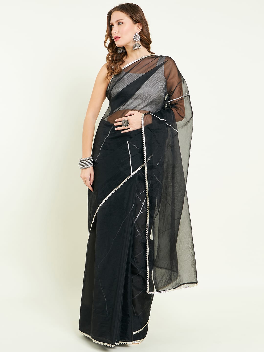 Organza saree with silver lace border comes with matching gota detailing blouse.