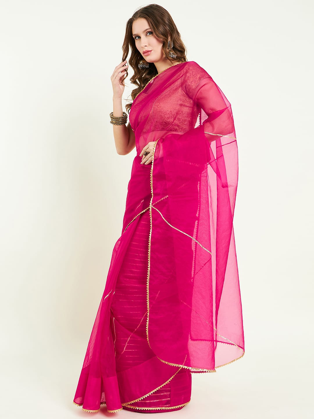 Organza saree with gota lace detailing on saree comes with heavy gota blouse.