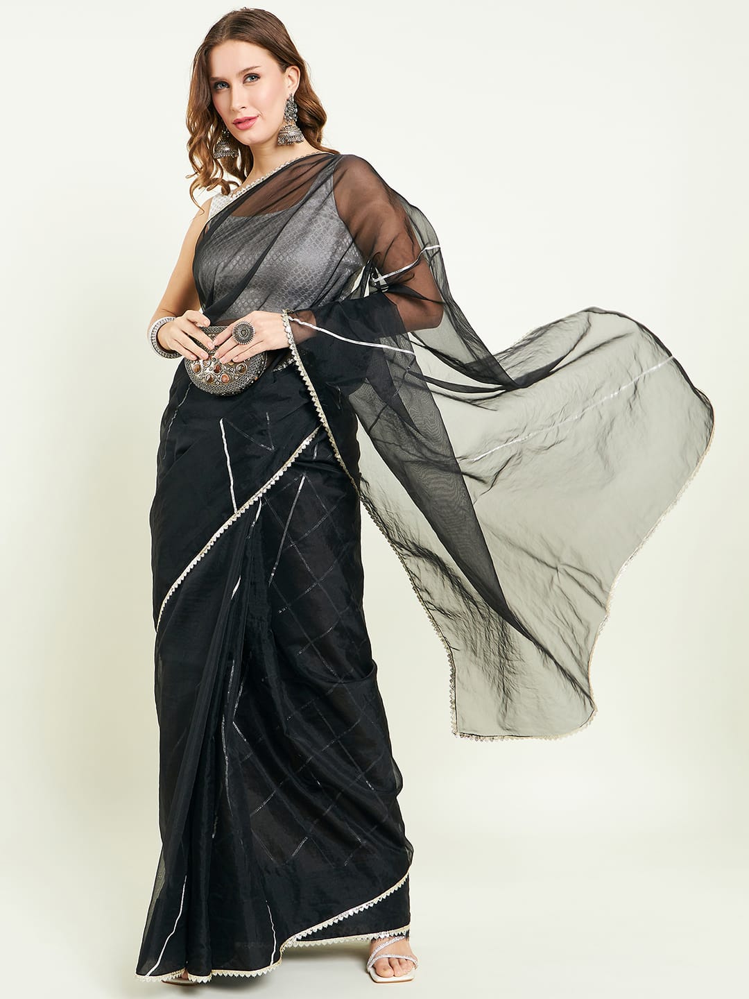 Organza saree with silver lace border comes with matching gota detailing blouse.