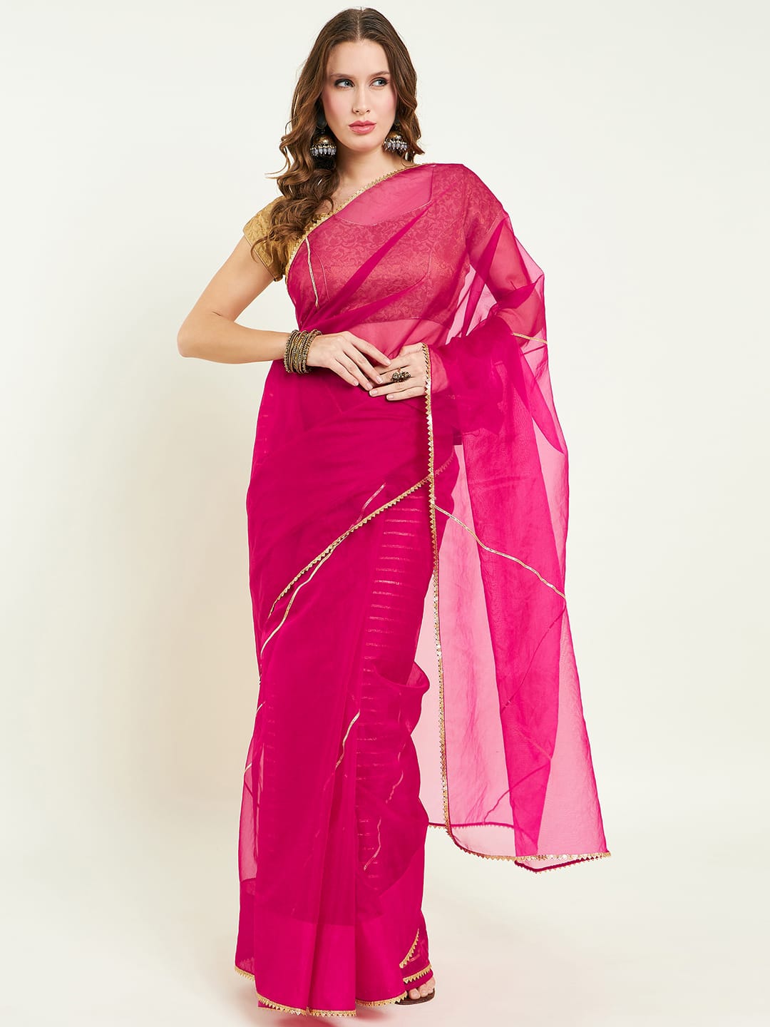 Organza saree with gota lace detailing on saree comes with heavy gota blouse.