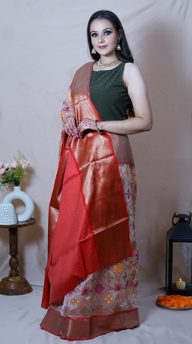 CORAL COLORED PATOLA SAREE WITH MULTICOLORED MOTIFS